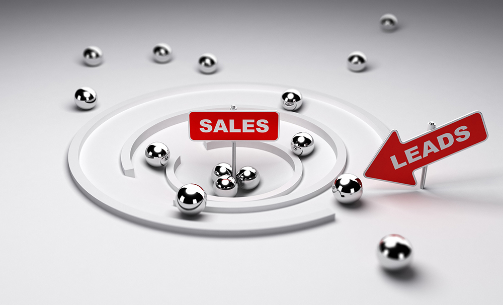 A funnel acting as the lead qualification process by filtering metal balls onto the sales target