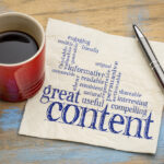 Content marketing for lead nurturing written on a napkin next to a coffee mug
