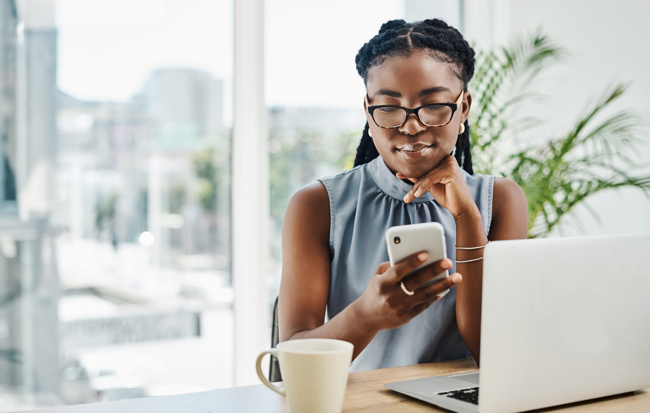 Consumer seeing multi-device marketing on her phone and laptop