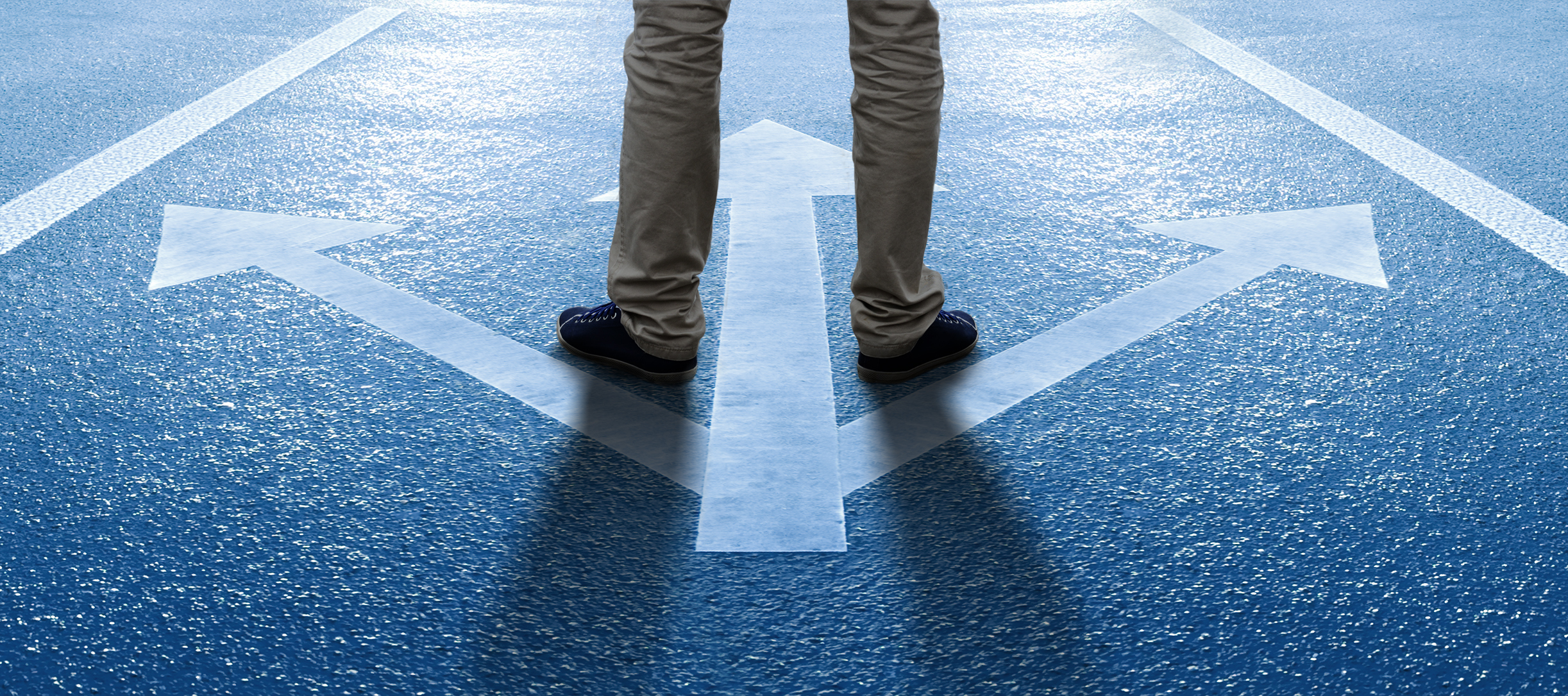 Man stands in front of arrows pointing to new business opportunities