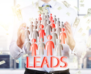 Man drawing a group of small people toward him with money flying all around him to represent generating quality leads in business.