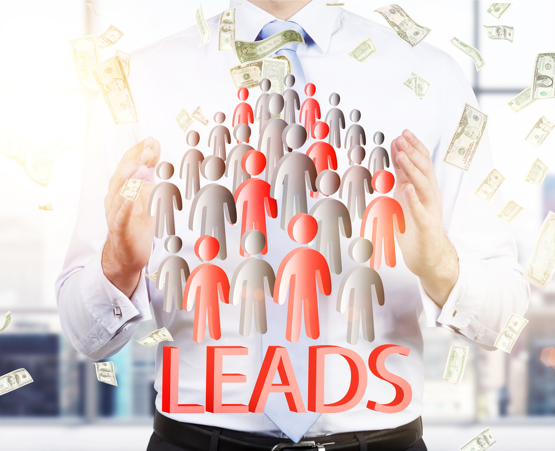 Man drawing a group of small people toward him with money flying all around him to represent generating quality leads in business.