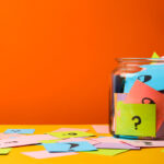 Jar filled with papers with questions for the website FAQ page