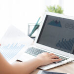 Woman performing sales reporting